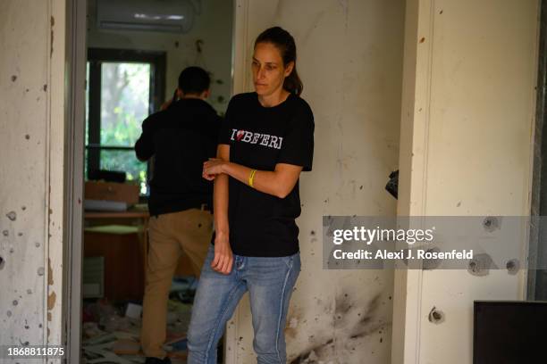 Nirit Hunwald , a Kibbutz Be’eri nurse, stands in a room covered in grenade and shrapnel holes in a dental clinic at her kibbutz since the Oct 7...