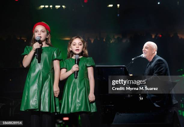 Billy Joel performs with his daughters Della Joel and Remy Joel at Madison Square Garden on December 19, 2023 in New York City.