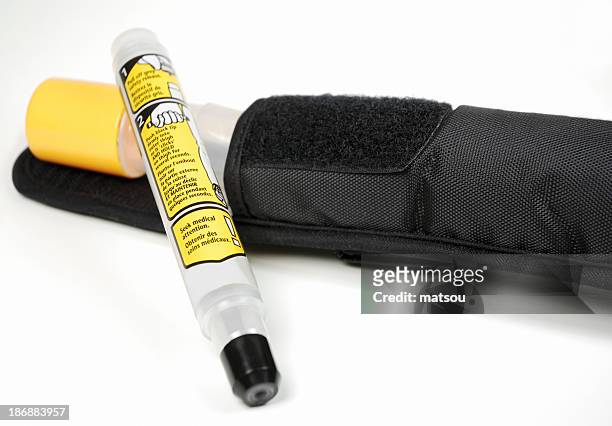 close up of an epinephrine injector for allergic reactions - adrenaline injection stock pictures, royalty-free photos & images