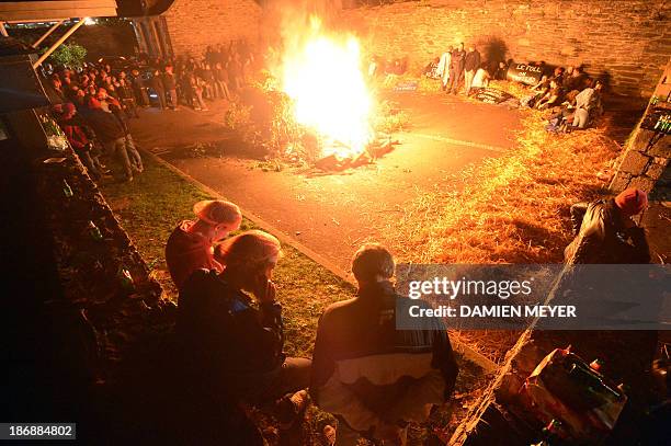 People sit during a demonstration of employees of Tilly-Sabco, an agrofood entreprise in financial difficulties, in a courtyard of the Finistere's...