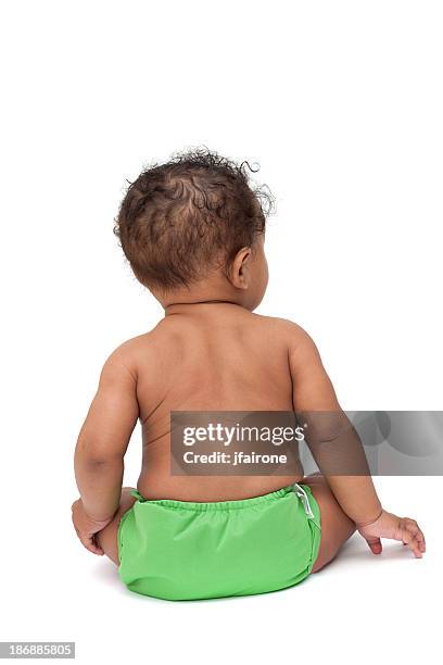 baby in green cloth diaper from behind - baby bottom stock pictures, royalty-free photos & images