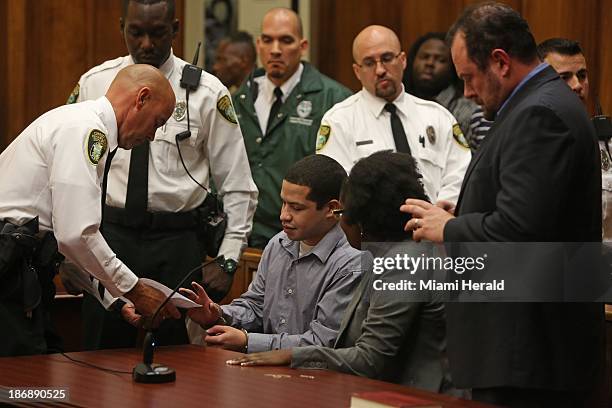 Eric Rivera Jr. Is being fingerprinted after a jury found him guilty with second-degree murder in the death of football player Sean Taylor in Miami,...