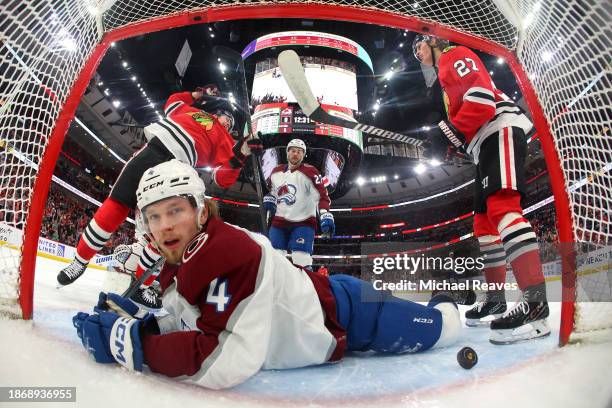 Ryan Donato of the Chicago Blackhawks celebrates after scoring a goal past goalie Alexandar Georgiev and Bowen Byram of the Colorado Avalanche during...