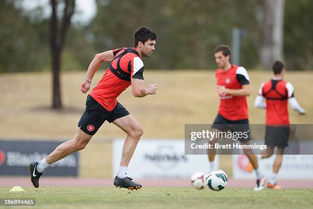 Michael Beauchamp of the Wanderers dribbles the ball during a Western Sydney Wanderers A-League training session at Blacktown International...