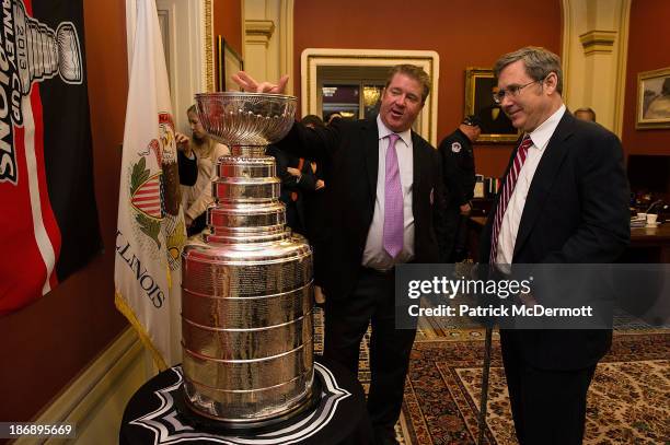 Mike Bolt speaks with Sen. Mark Kirk during an event celebrating the Chicago Blackhawks Stanley Cup win in 2013 at United States Capitol Building on...