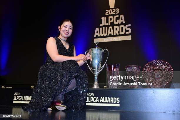 Miyuu Yamashita of Japan poses with trophies after the JLPGA Awards 2023 on December 20, 2023 in Tokyo, Japan.