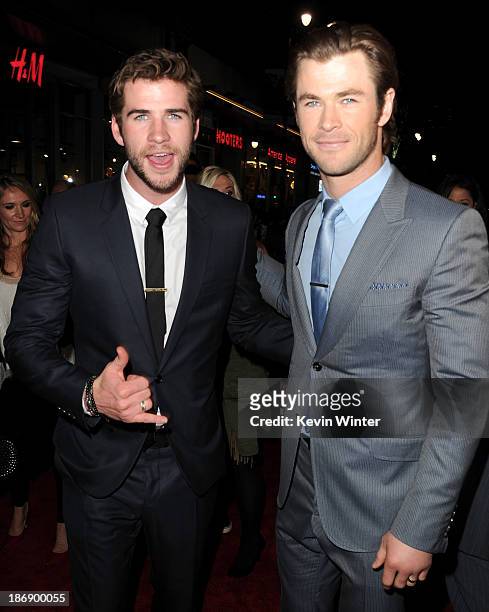Actors Liam Hemsworth and Chris Hemsworth arrive at the premiere of Marvel's "Thor: The Dark World" at the El Capitan Theatre on November 4, 2013 in...