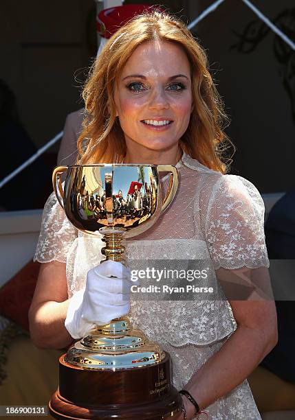Geri Halliwell poses with the Melbourne Cup during Melbourne Cup Day at Flemington Racecourse on November 5, 2013 in Melbourne, Australia.