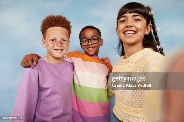 happy girl taking selfie with multiracial friends - iranian people stock pictures, royalty-free photos & images