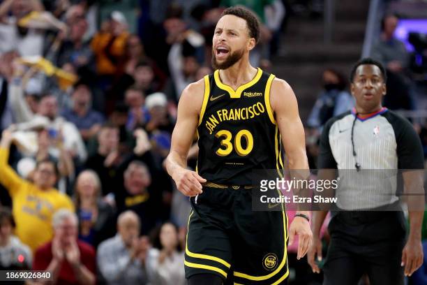 Stephen Curry of the Golden State Warriors reacts during their game against the Boston Celtics at Chase Center on December 19, 2023 in San Francisco,...