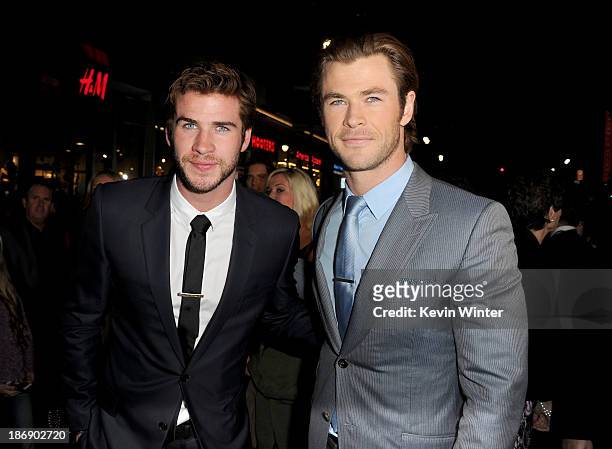 Actors Liam Hemsworth and Chris Hemsworth arrive at the premiere of Marvel's "Thor: The Dark World" at the El Capitan Theatre on November 4, 2013 in...