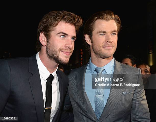 Actors Liam Hemsworth and Chris Hemsworth attend Marvel's "Thor: The Dark World" Premiere at the El Capitan Theatre on November 4, 2013 in Hollywood,...