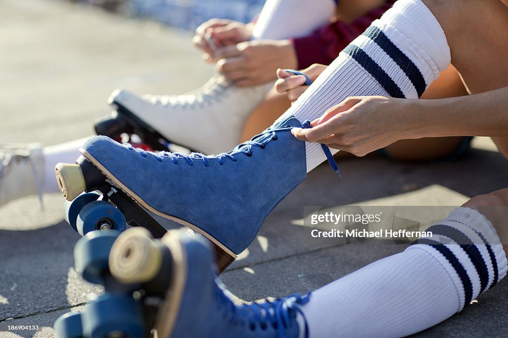 Close up of rollerskates being laced up