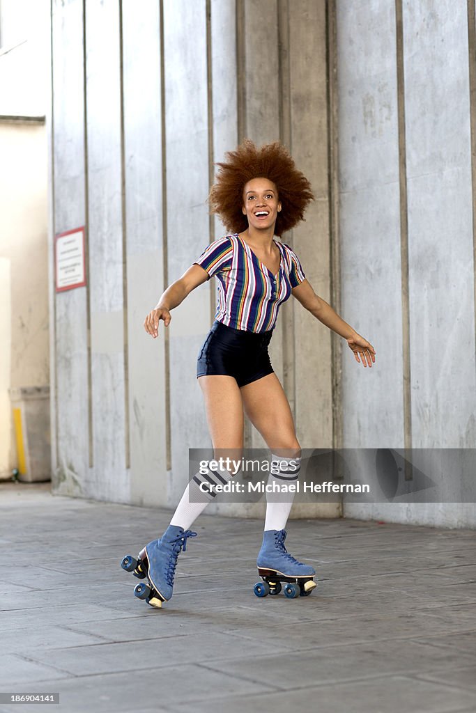 Young woman rollerskating