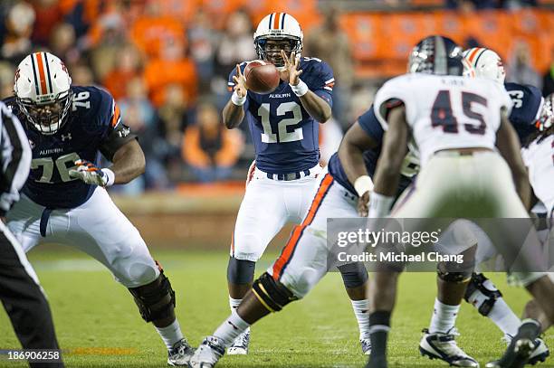 Quarterback Jonathan Wallace of the Auburn Tigers hikes the ball during their game against the Florida Atlantic Owls on October 26, 2013 at...