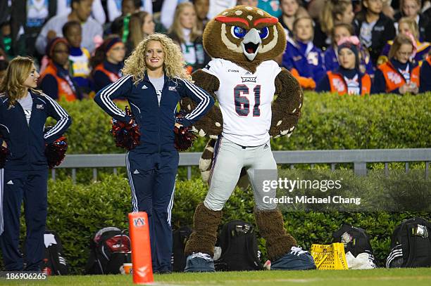 Mascot Owlsey of the Florida Atlantic Owls poses with a cheerleader during their game against the Auburn Tigers on October 26, 2013 at Jordan-Hare...