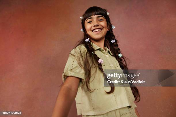 low angle view of smiling girl with long hair and bangs - iranian people stock pictures, royalty-free photos & images