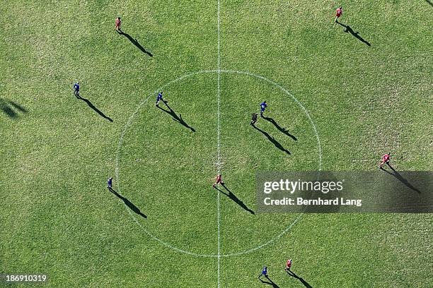 aerial view of players on football pitch - bolzplatz stock-fotos und bilder