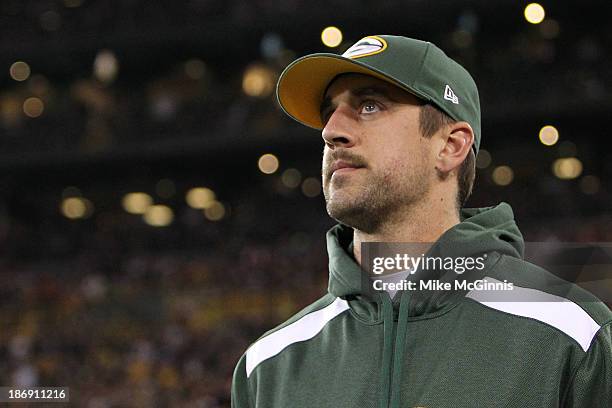 Aaron Rodgers of the Green Bay Packers returns to the field after a colar bone injury which occurred in the first half of the game against the...
