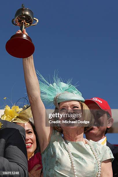 Trainer Gai Waterhouse holds up the Melbourne Cup after winning with Fiorente in race 7 The Emirates Melbourne Cup during Melbourne Cup Day at...