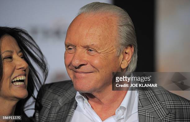 Actor Sir Anthony Hopkins with family arrive at the premiere of Marvel's 'Thor: The Dark World' at the El Capitan Theatre on November 04, 2013 in...