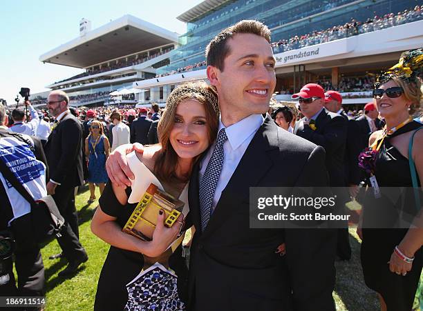 Tom Waterhouse and Kate Waterhouse celebrate after the Gai Waterhouse trained horse Fiorente wins the Melbourne Cup during Melbourne Cup Day at...