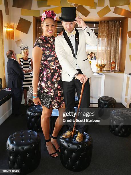 Elizabeth "Liz" Cambage and Brodie Young attend the Johnnie Walker marquee during Melbourne Cup Day at Flemington Racecourse on November 5, 2013 in...