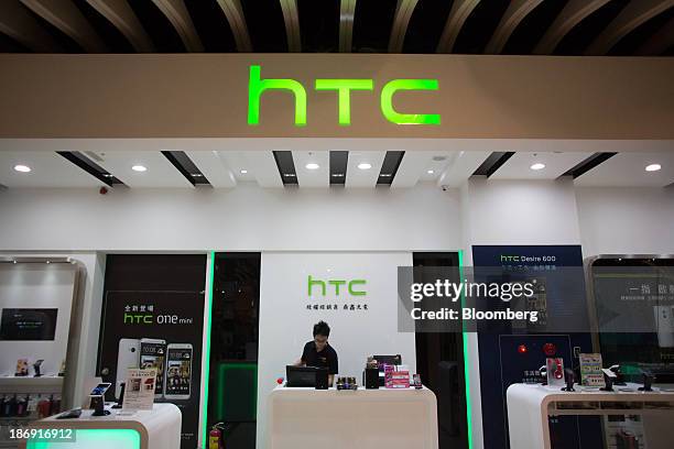 Corp. Signage is displayed at one of the company's stores in Taipei, Taiwan, on Monday, Nov. 4, 2013. Taiwans five-year bonds gained for the first...