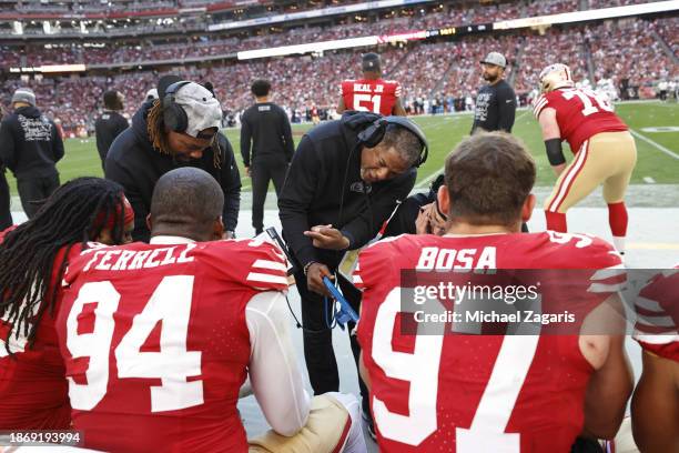 Defensive Coordinator Steve Wilks of the San Francisco 49ers with the defensive line on the sideline during the game against the Arizona Cardinals at...