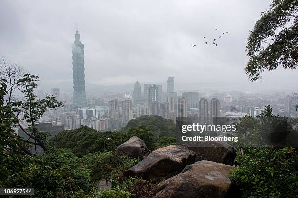 The Taipei 101 building, left, stands among residential and commercial buildings in Taipei, Taiwan, on Monday, Nov. 4, 2013. Taiwans five-year bonds...