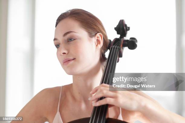 portrait of a cello player - violin family stock pictures, royalty-free photos & images