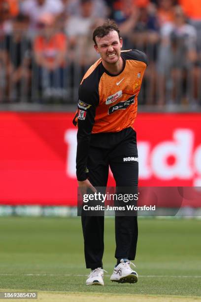 Ashton Turner of the Scorchers reacts after injuring himself during the BBL match between Perth Scorchers and Hobart Hurricanes at Optus Stadium, on...