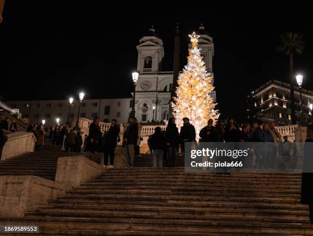 christmas decorations and light in piazza di spagna of rome 2023 - christmas lights up in piazza di spagna rome stock pictures, royalty-free photos & images