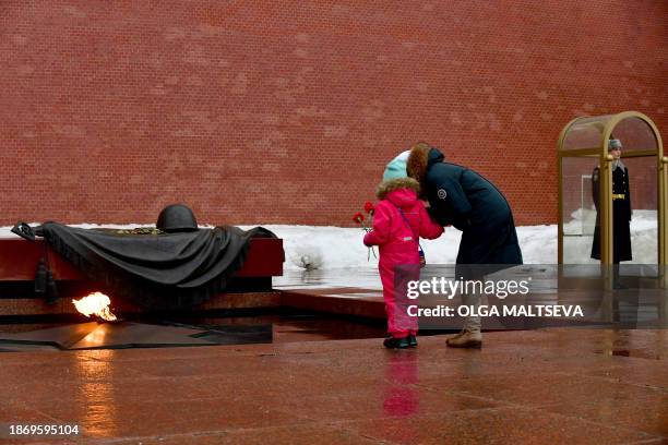 Relatives of Russian soldiers, taking part in the so-called "special military operation" in Ukraine, lay flowers at the Tomb of the Unknown Soldier...