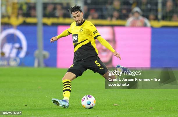 Ramy Bensebaini of Dortmund plays the ball during the Bundesliga match between Borussia Dortmund and RB Leipzig at Signal Iduna Park on December 9,...