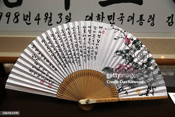 Fan gifted to Queen Elizabeth II by Mr. Ry Young-ha during her visit to Hahoe Village in Korea is on display before being shown to The President of...