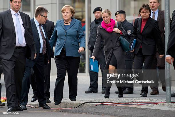 German Chancellor Angela Merkel, her media councellor Eva Christiansen and her head of office, Beate Baumann arrive for negotiations between the...