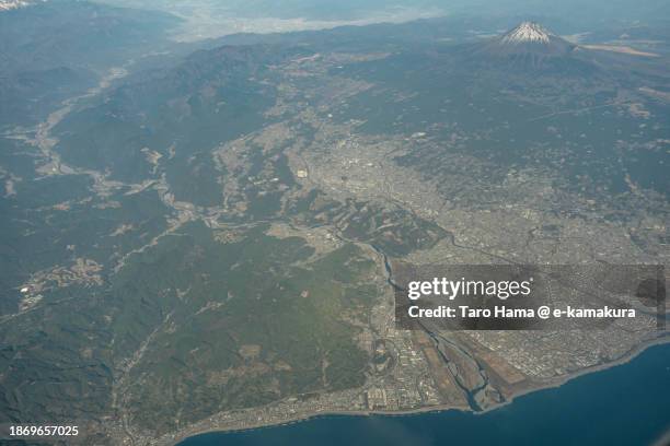 snowcapped mt. fuji in shizuoka of japan aerial view from airplane - suruga bay stock pictures, royalty-free photos & images