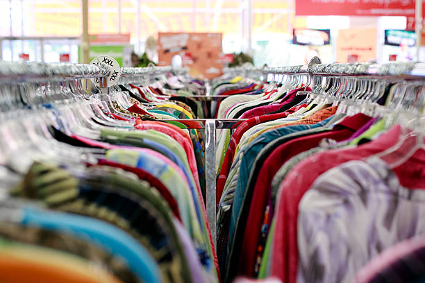 Where to Sell Second Hand Clothes? 1 thrift store clothing racks