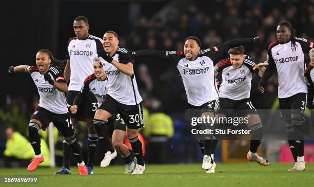 Players of Fulham celebrate after Tosin Adarabioyo of Fulham scores their sides winning penalty during the Carabao Cup Quarter Final match between...