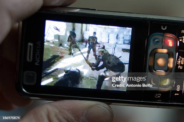 Free Syrian Army members of the Mujahadee Al Sunna katiba watch a video of government Army soldiers torturing and executing a Free Syrian Army...