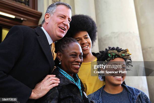 New York Democratic mayoral candidate Bill de Blasio poses with his family, wife Chirlane McCray, son Dante de Blasio and daughter Chiara de Blasio...