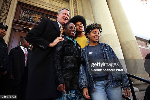 New York Democratic mayoral candidate Bill de Blasio poses with his family, wife Chirlane McCray, son Dante de Blasio and daughter Chiara de Blasio...