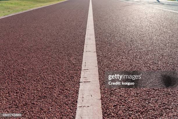 close-up of red sidewalk with light effects - xiamen stock pictures, royalty-free photos & images