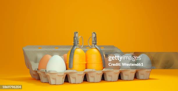 3d render of egg carton with two hand grenades - egg toss game stock illustrations