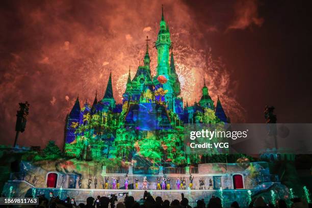 Fireworks explode over the Enchanted Storybook Castle during the grand opening ceremony of Shanghai Disney Resort's Zootopia-themed land on December...