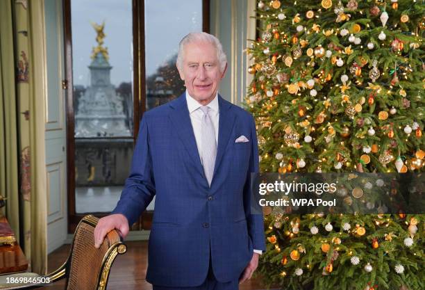 In this image released on December 23 King Charles III poses during the recording of his Christmas message at Buckingham Palace on December 7, 2023...