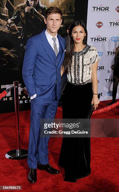 Actors Jonathan Howard and Elodie Yung arrive at the Los Angeles premiere of "Thor: The Dark World" at the El Capitan Theatre on November 4, 2013 in...
