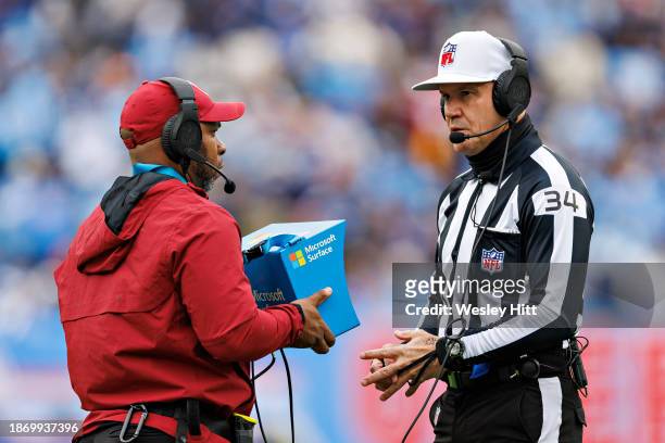 Referee Clete Balkeman watches a replay on the field during a game between the Houston Texans and the Tennessee Titans at Nissan Stadium on December...