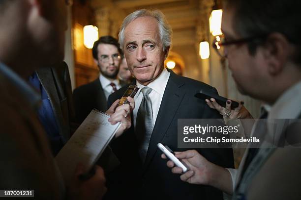 Sen. Bob Corker talks with reporters before attending the weekly Republican Senate caucus policy luncheon at the U.S. Capitol November 5, 2013 in...